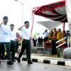 Meski Diguyur Hujan, Warga Antusias Saksikan Lomba Gerak Jalan di Beltim